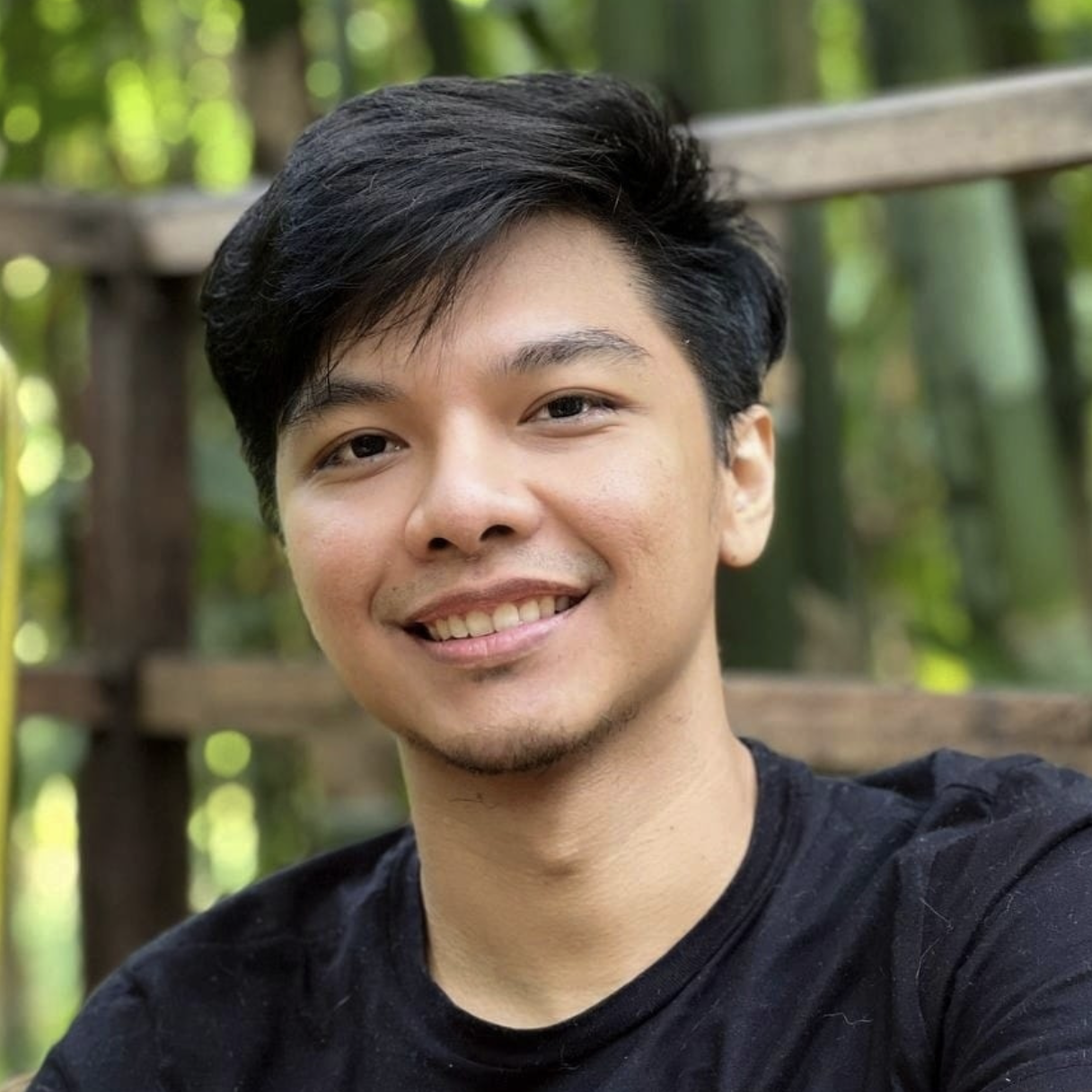 A Filipino man smiling and wearing a black shirt